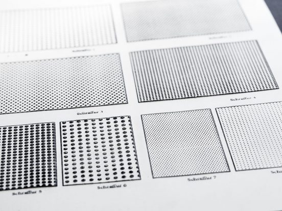 A page of swell paper with different dot pattern surfaces